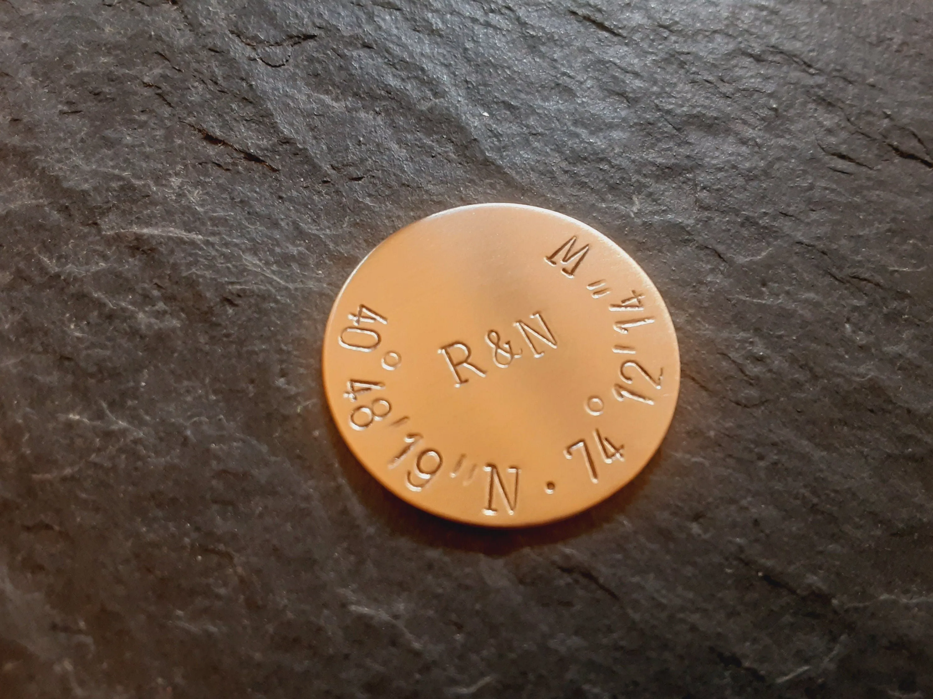 Bronze golf ball marker with latitude longitude
