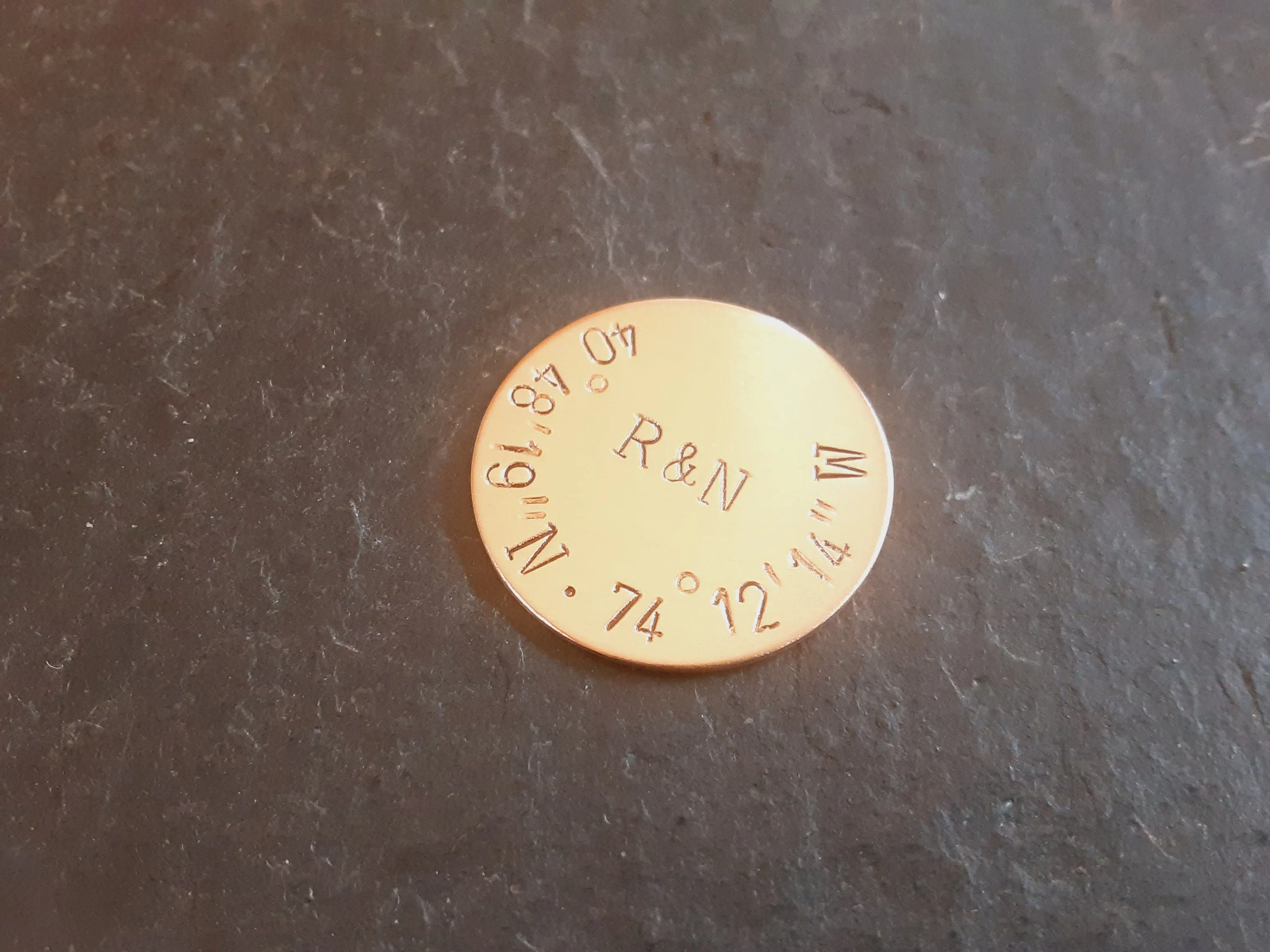 Bronze golf ball marker with latitude longitude