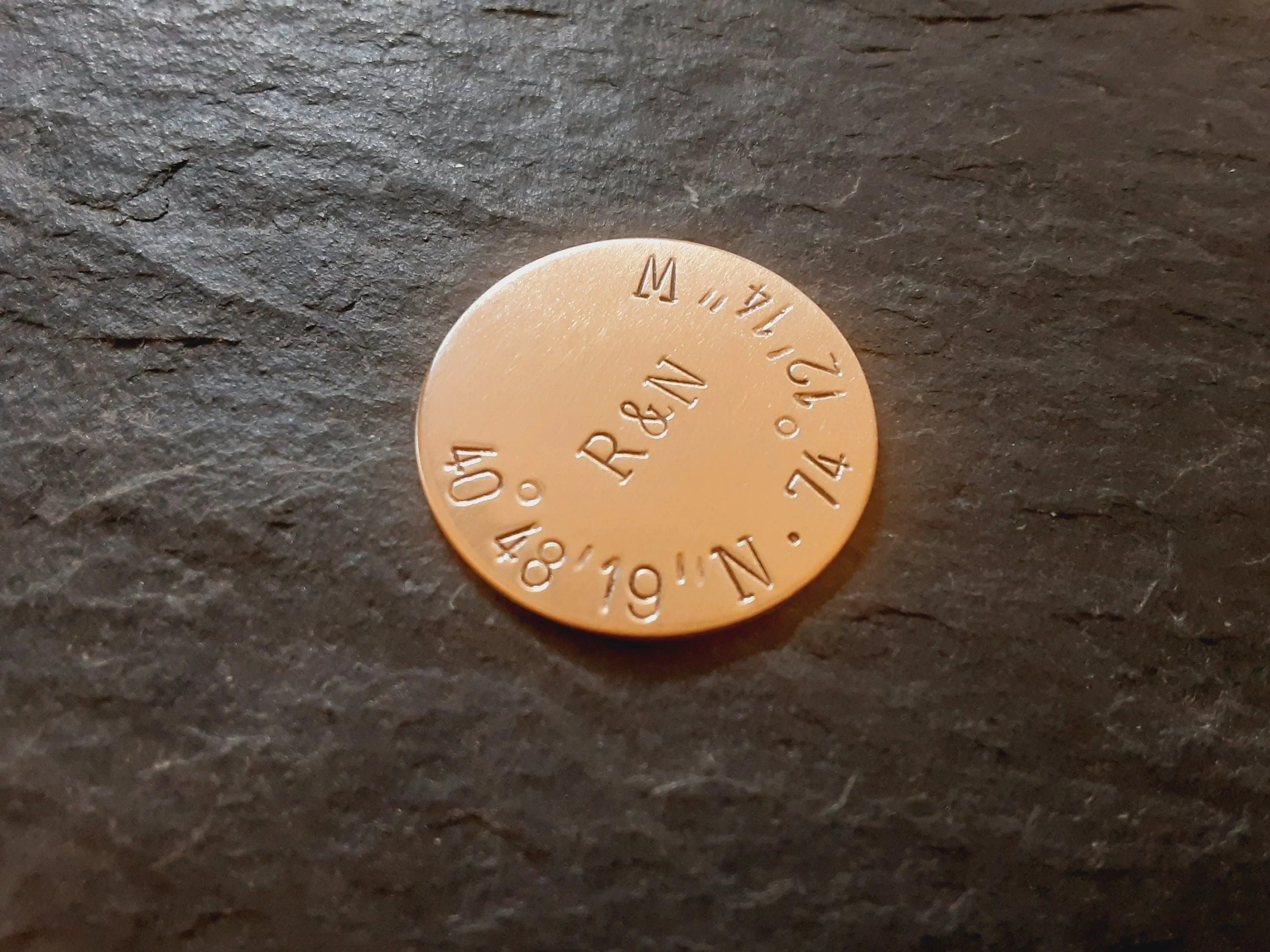 Bronze golf ball marker with latitude longitude