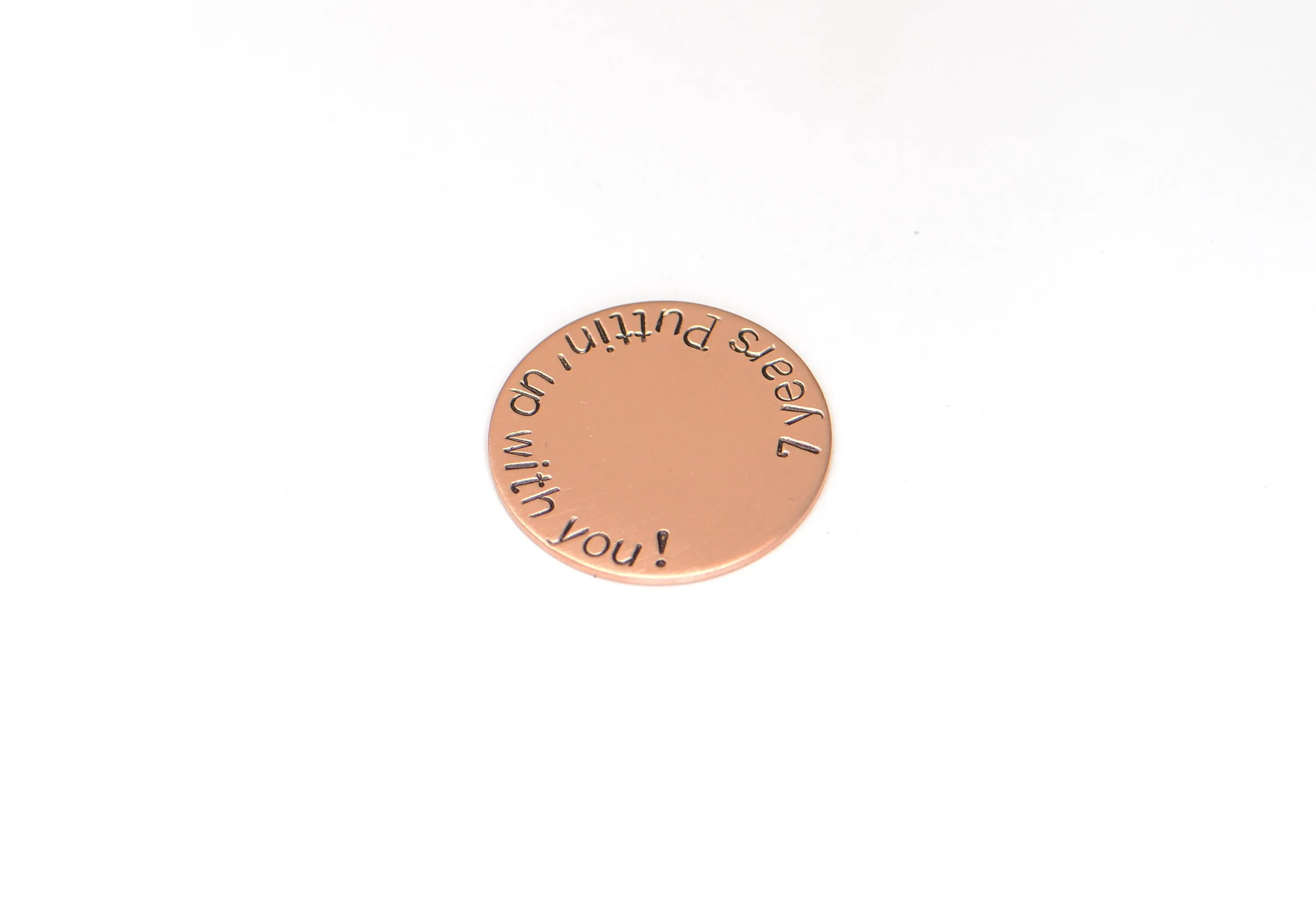 Copper golf ball marker for the 7th anniversary